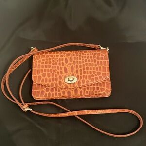 Fold over cross body bag with wallet compartments. Like new.